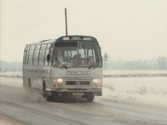 289/02 Premier Travel Services CJE 453V passing Barton Mills - 9 Feb 1985