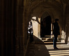 Visitors in Cloister Shadows