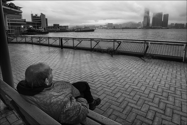 Sitting on a bench.