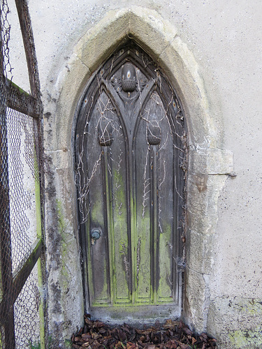 gestingthorpe church, essex (7)disused priests' door with acorns, mid c20 ?