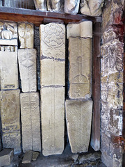 bakewell  church, derbs (85)mostly c13 cross slabs in the porch found reused as building stone in the late c13 tower