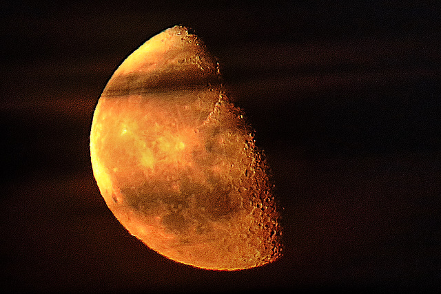 Clouds across the moonrise