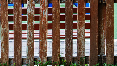 bench through fence