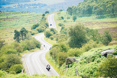 A motorcyclist approaches 'Toads mouth' on the A6187 towards 'Hathersage' - Derbyshire..