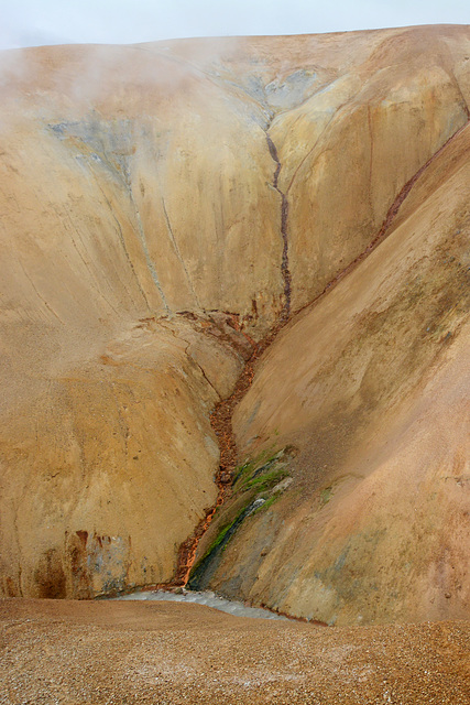 Iceland, Bright Red Water of the Stream on the Slope of Kerlingarfjöll