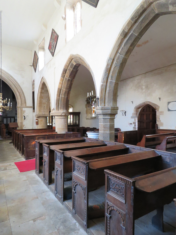 rousham church, oxon ; c12 eastern arch, c14 western arcade, pews made up with c17 work