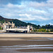 Conway Castle with a train about to enter the tunnel.