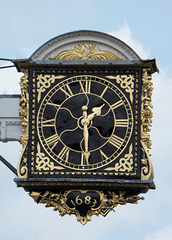 The projecting clock of the historic Guildford Guildhall.