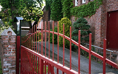 Red iron gate of a church