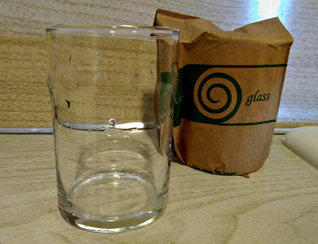 Old fashioned paper-wrapped glass
