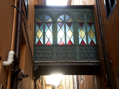 Upper passage with stained glass.