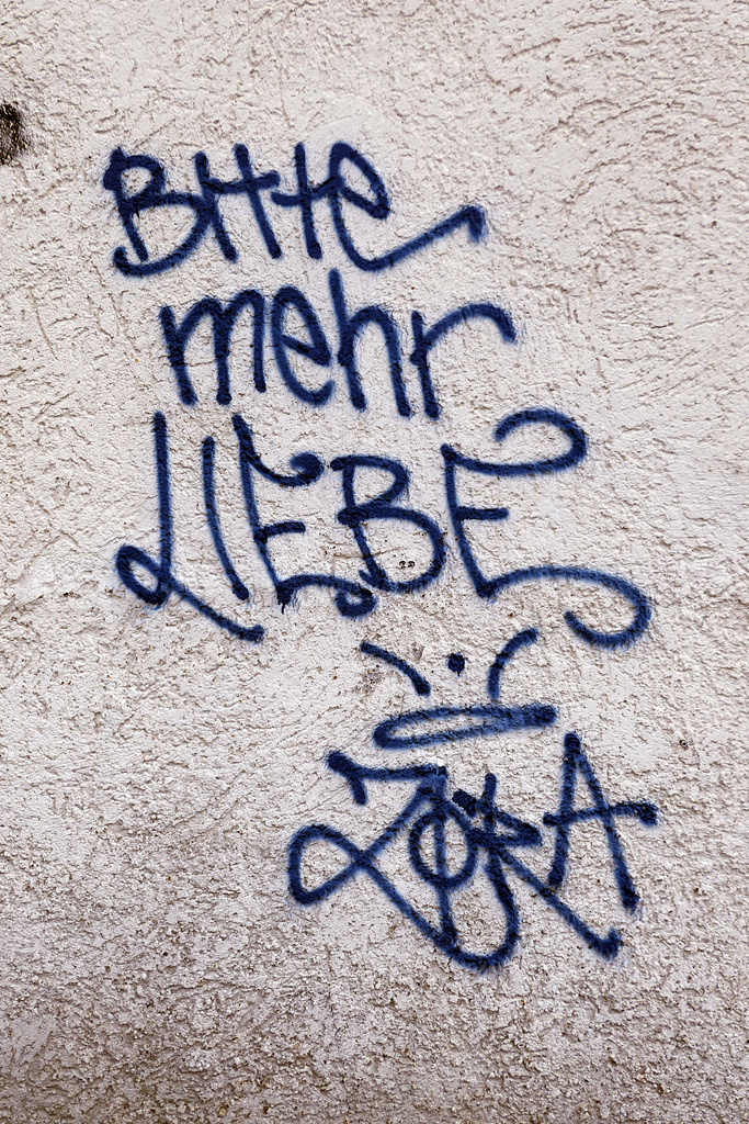 Bitte an der Wand