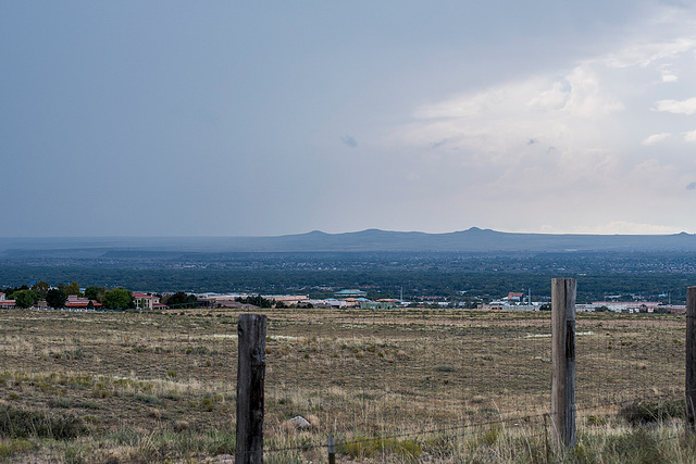 A view across Albuquerque with volcano 's in the background