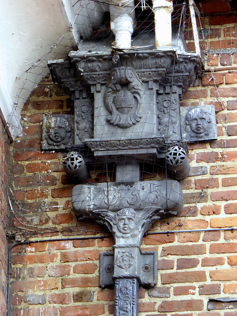 An ornate lead rainwater hopper