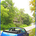 Blue convertible PT Cruiser & haunted house