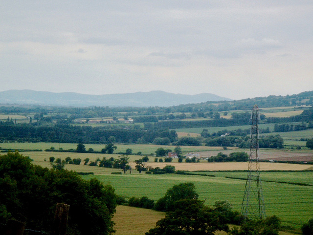 The distant Malvern Hills seen from the approach to Ashton under Hill