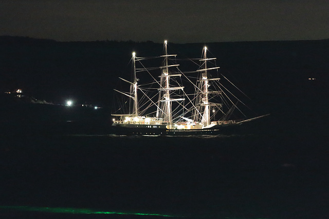 S.V. Tenacious with Osmington Mills in the distance