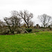 Church of All Saints at Grendon seen over the disused bridge (Grade II* Listed Building)