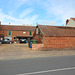 Outbuilding to The Green Dragon Inn, Broad Street, Bungay, Suffolk with brewery beyond