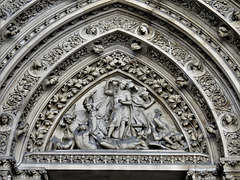 st michael cornhill, london (4)tympanum over main north porch by scott 1857-60, st michael disputing with satan about the body of moses by birnie philip