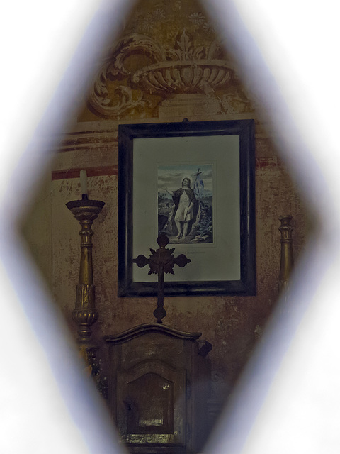 Peering through the dense grating in the little church of San Rocco in Rosei, a small village above Piedicavallo (Biella)