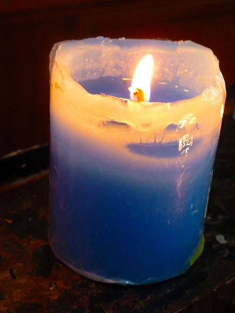 Yellow candle in the Parroquia Santuario Nuestra Señora de Guadalupe , Lima, Peru