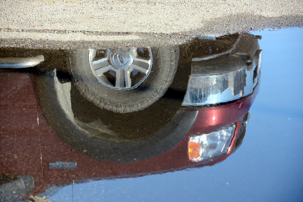 Through a puddle, darkly