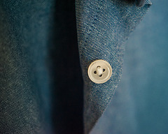 Blue Shirt with a White Button