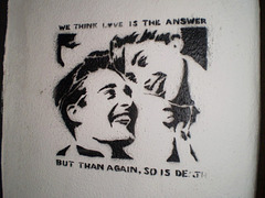 Stencil on wall of former jail.