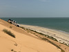 Down the dunes.