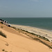 Down the dunes.