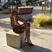 Sculpture of sitting woman.