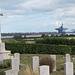 shotley church, suffolk (22) view across c20 naval graves past blomfield's war memorial cross to felixstowe docks