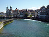 Luzern mit dem Nadelwehr in der Reusss, im Hintergrund die Jesuitenkirche