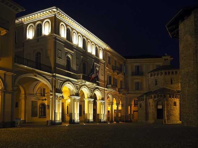 Biella (Italy), lights from the Town Hall. To the right the Baptistery of St. John the Baptist