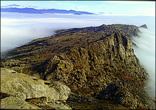 Sierra de La Cabrera rising above the fog