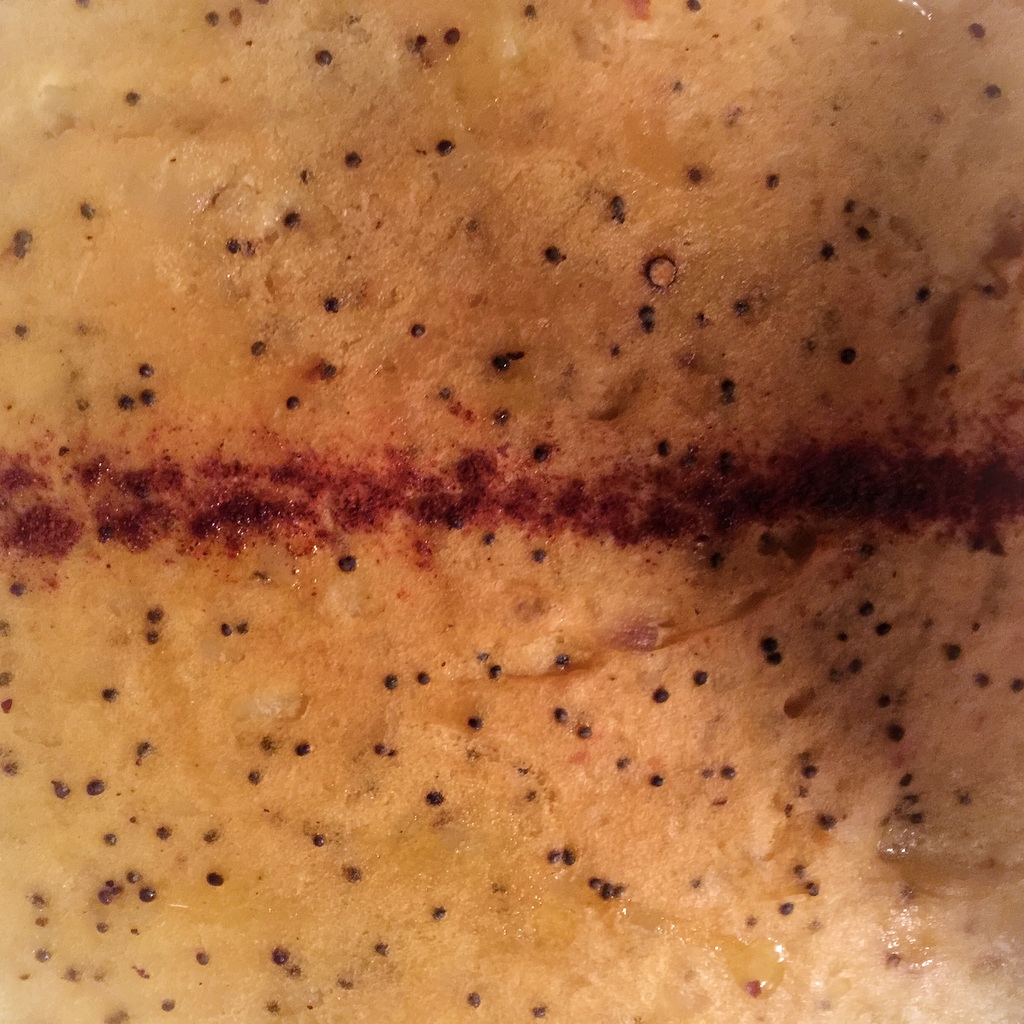 cottage pie with turmeric, black mustard seeds and black peppery potatoes on top