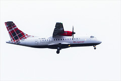 Loganair Plane Flying over the River Clyde to Land at Glasgow Airport