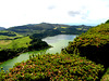 The Pico do Ferro, surrounded by exuberant vegetation, offers a  view over the lake within the crater of extinct volcano