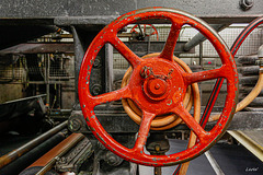 Red wheel of historic paper machine