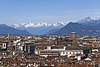 Turin from the top of the bell tower of the St. John Baptist Cathedral - From the rooftops and innumerable skylights of the city to the Susa Valley (To the left on the spur, one can see the Sacra of San Michele)