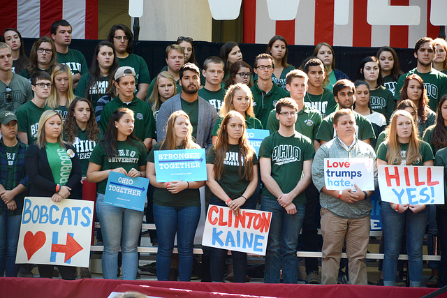 Students brought in to hold signs looked worried