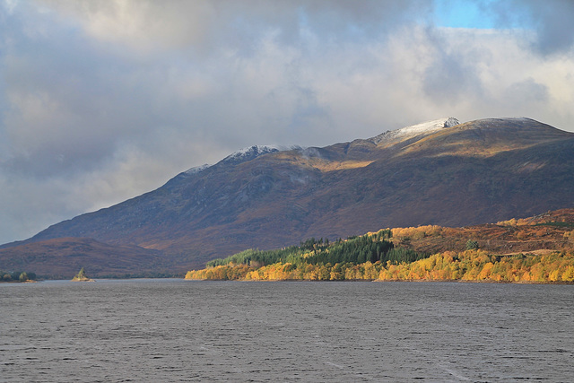 Snow capped Creag Meagaidh over Loch Laggan