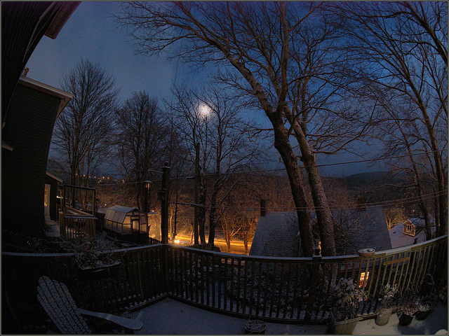 Moon shining through a little dwy of snow