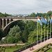 Flags Flying In Front Of Pont Adolphe