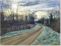 The country road winds its way through a frosty morning.