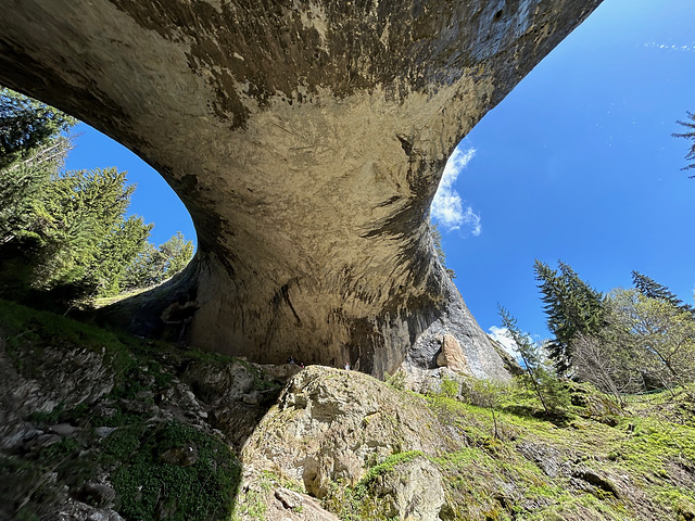 Under the stone bridge.