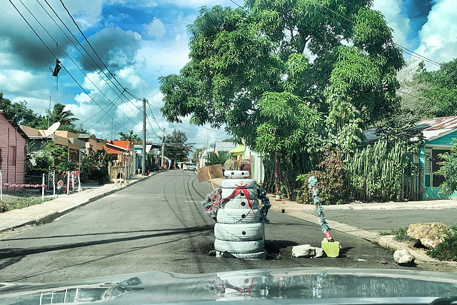 Be careful, there's a hole on the road