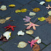 Autumn leaves of Lime, Sweetgum and Maple decorate the sidewalk