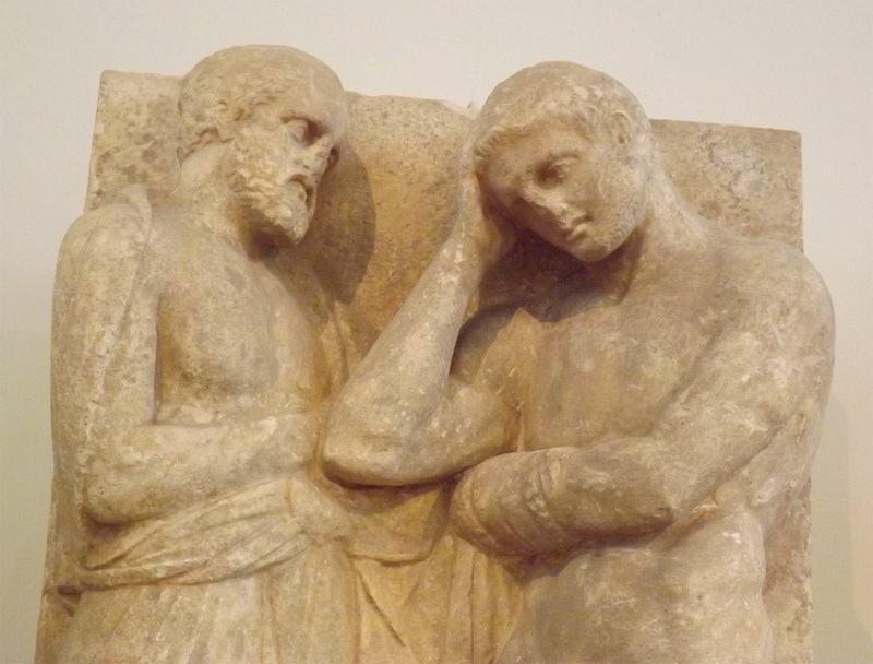 Detail of a Grave Stele from the Kerameikos in Athens with a Young Man, his Father and a Slave in the National Archaeological Museum of Athens, May 2014